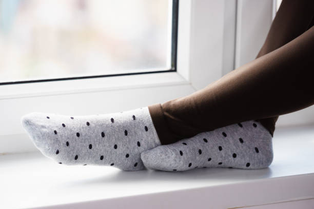 istock Woman wearing grey dotted socks 956773136