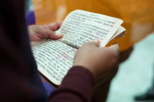 HIndu Priest reading sacred texts at wedding in Kathmandu ,Nepal.