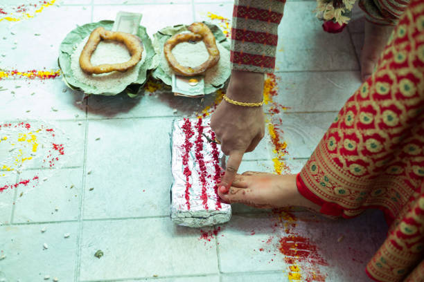 istock Nepalese Bride and Groom Performing Wedding Rituals  at Marriage Ceremony 956777566