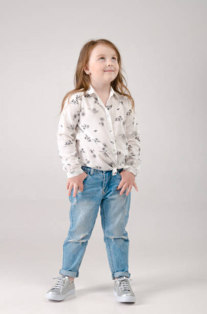 istock child in the Studio posing in fashionable clothes 956778680