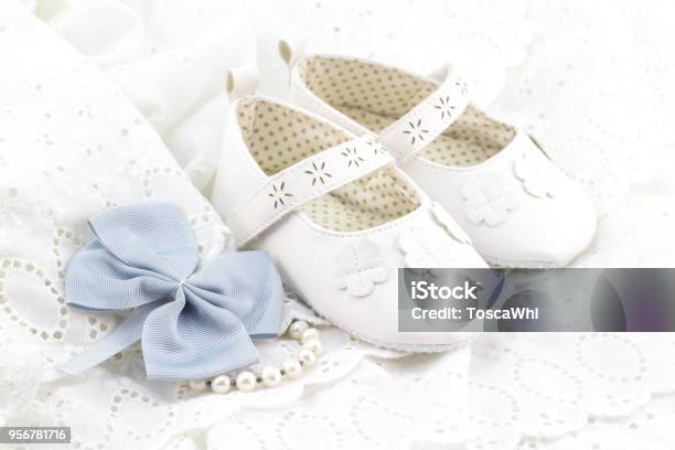 Baby White Baptism Or Birthday Dress And Shoes Close Up With Space For Text Stock Photo - Download Image Now
