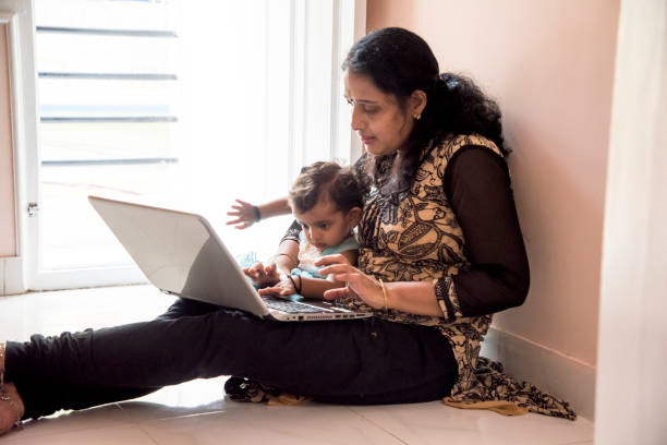 istock mother and daughter watching laptop 956791368