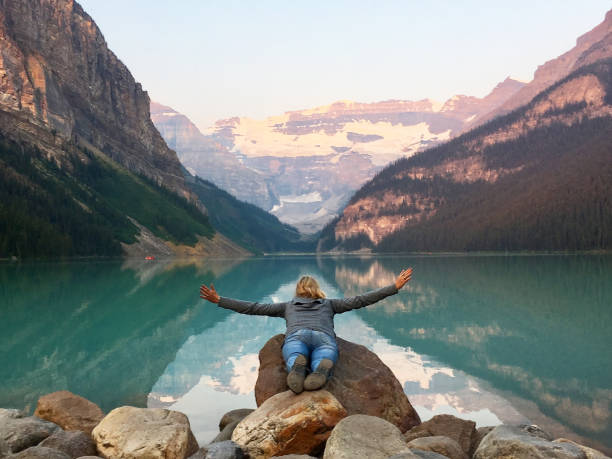 istock Open arms over Lake Louise Canada 956791742