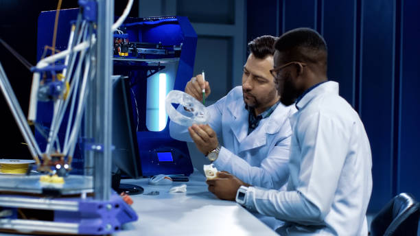 istock Scientists working on 3-D printing in medicine purposes 956791874