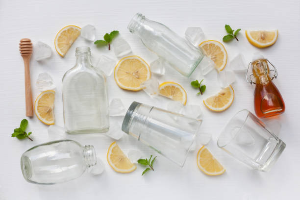 istock Glasses and bottle for drinks with lemon slices, mint and honey . 956792684
