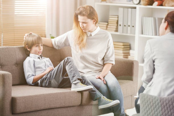 istock Shy kid and caring mother 956795768