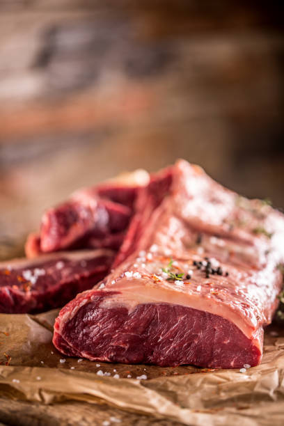 istock Raw rib eye beef steak with salt spices and herbs 956807520