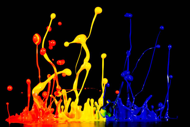 istock splash of acrylic paint, abstract background on black 956808212