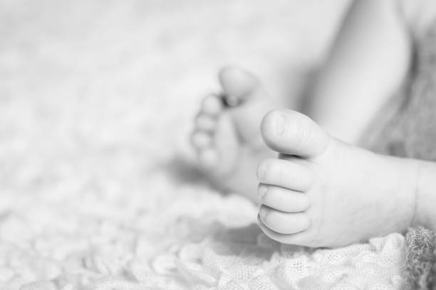 istock portrait baby feet 956809240