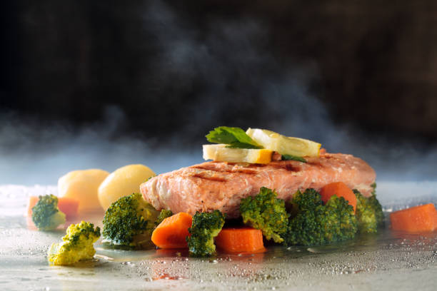istock Salmon and steamed vegetables. 956810402