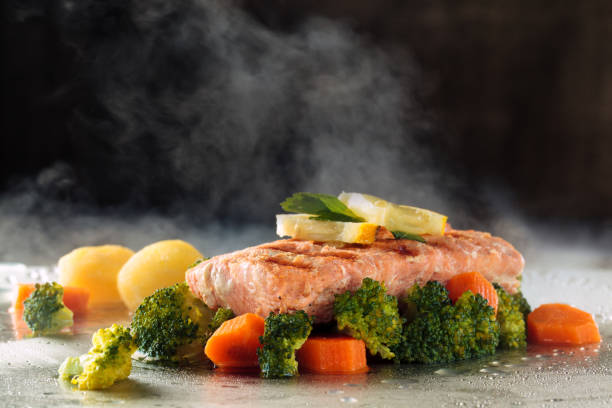 istock Salmon and steamed vegetables. 956810444