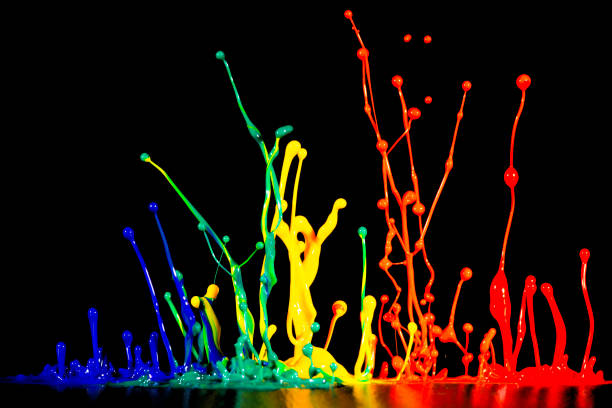 istock splash of acrylic paint, colored abstract background on black 956810464