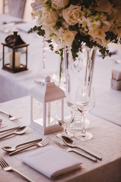 istock Table setting at a luxury wedding and Beautiful flowers on the table. 956814088