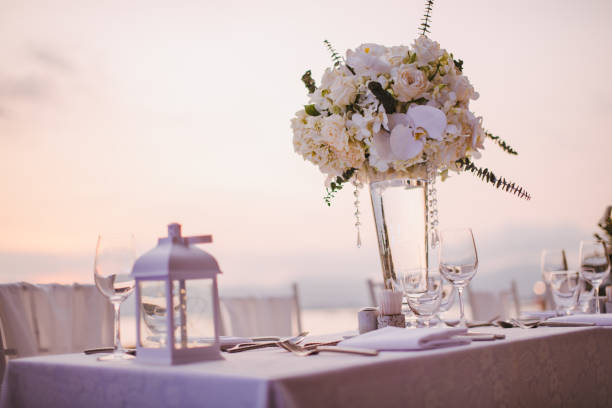 istock Table setting at a luxury wedding and Beautiful flowers on the table. 956814100