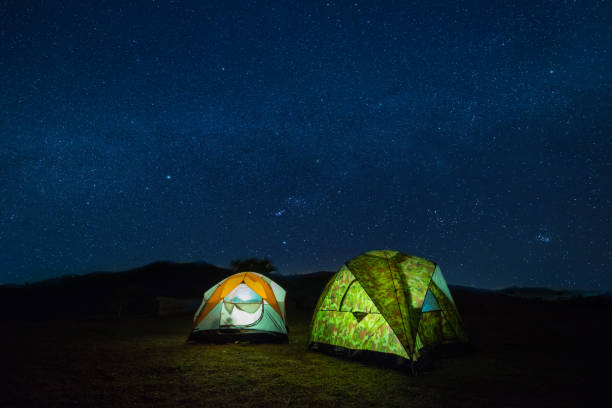 istock camping in moutain at night with star. 956814574