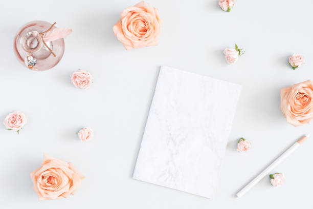 istock Notebook, rose flowers, marble paper blank. Flat lay, top view 956818466