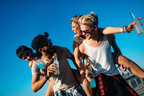 istock Group of young friends having fun together 956819744
