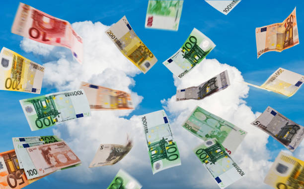 istock Euro money fallig down on the sky 956821144