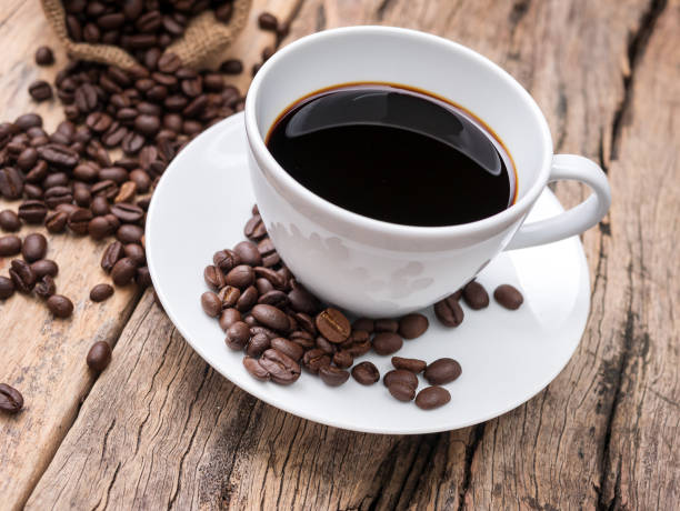istock fresh espresso coffee cup with coffee bean on wooden table. coffee background for cafe or coffee shop 956823698
