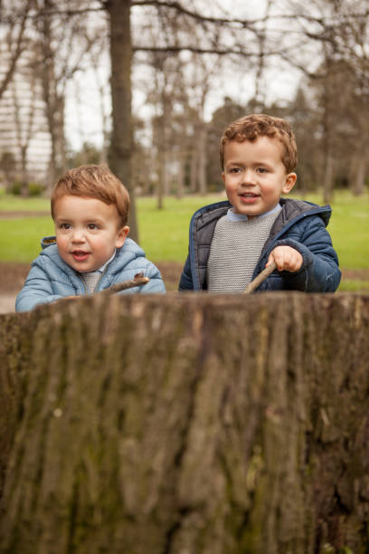 istock Brothers playing outdoors 956830614