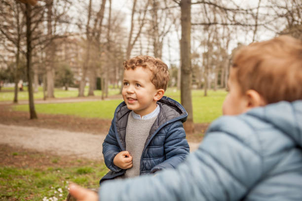 istock Brothers playing outdoors 956831296