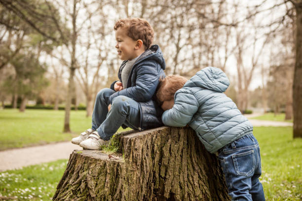 istock Brothers playing outdoors 956831426