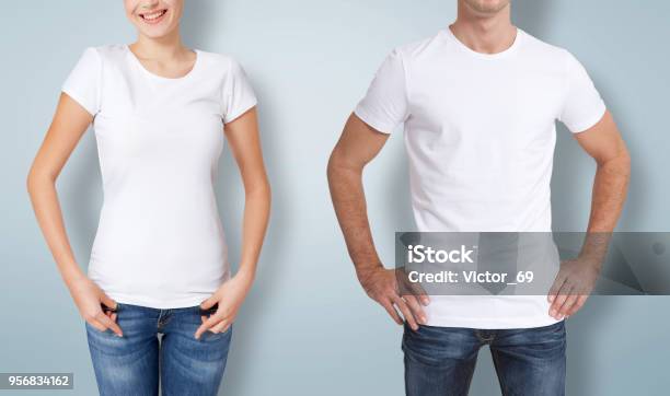 Shirt Design And People Concept Close Up Of Young Man And Woman In Blank White Tshirt Isolated Stock Photo - Download Image Now