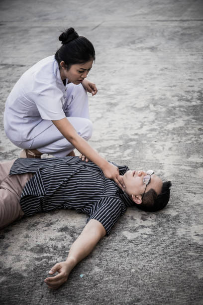 istock Emergency CPR on a Man, Nurse try to Process Resuscitation (First Aid) 956835150