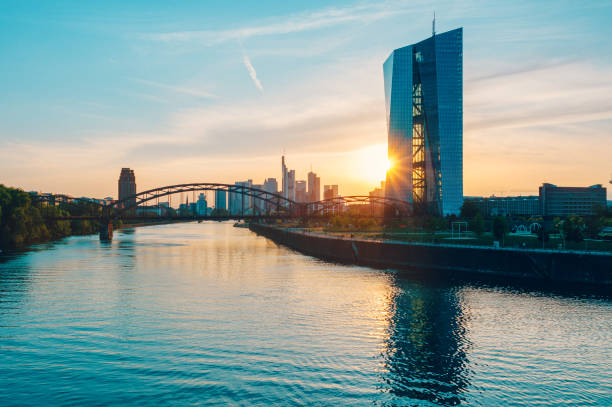 European Central Bank Building in Frankfurt The European Central Bank Building and the skyline of Frankfurt am Main during sunset. Toned image with added grain. central bank stock pictures, royalty-free photos & images