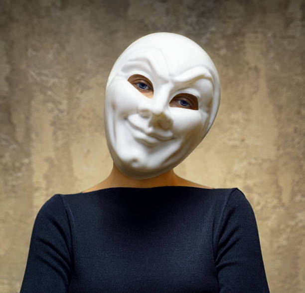 istock Woman in white mask. Horror concept 956840726