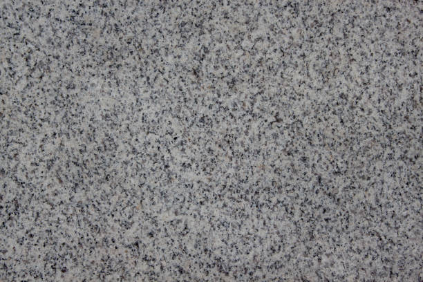 istock Abstract gray texture with different holes. Sandstone. Stone wall. 956840850