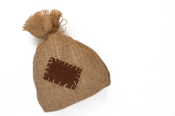 Bag of burlap with a patch on white background.
