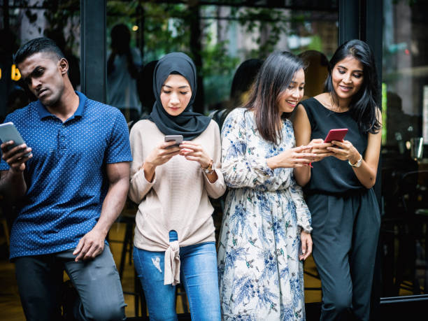 istock Young Asian people using smartphones 956842708