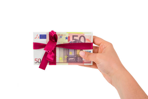 istock Stack of Euro with Ribbon as Gift 956846320