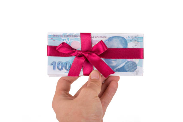 istock Hand Holding Turkish Lira Banknotes with Ribbon as Gift 956849342