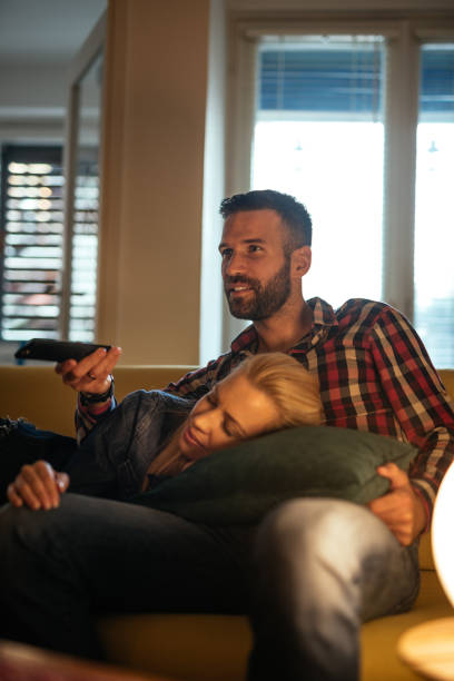 istock Watching tv at home 956851544