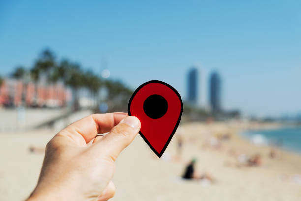 istock man with a red marker in La Barceloneta beach 956854082