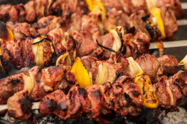 istock Pork barbecue  on grill with spices, closeup. 956854854