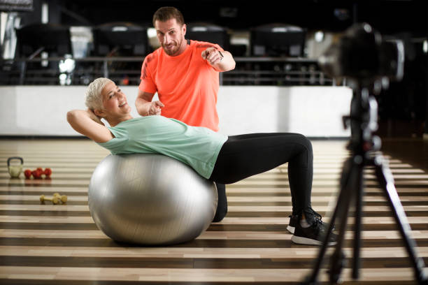 istock Senior woman exercising at the gym 956855926