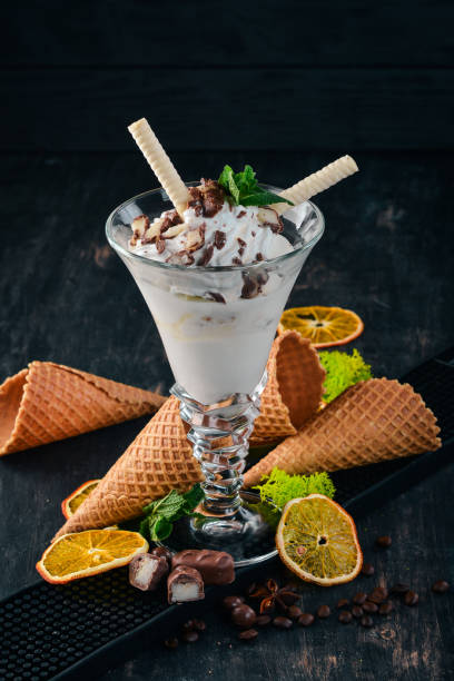 istock Creamy ice cream. On a black wooden background. Copy space. 956856562