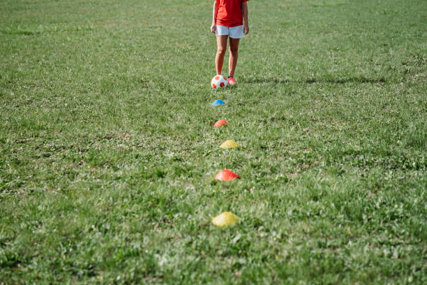 istock Young adult woman during a soccer training 956858982