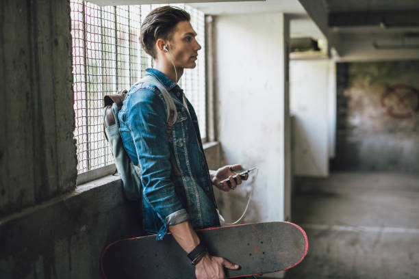 istock Teenager boy with skateboard 956859044