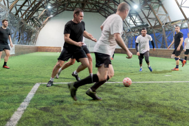 istock Soccer players training indoors 956865050