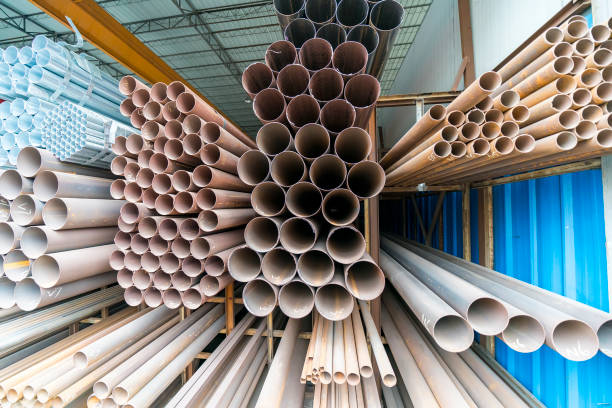 istock Different sizes of metal pipes on shelf 956865884