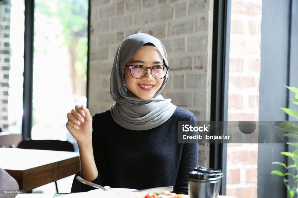 One women order in cafe and smile Malaysia Stock Photo