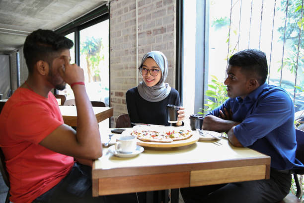 istock Three friends gathering for discussion and celebrating 956865960