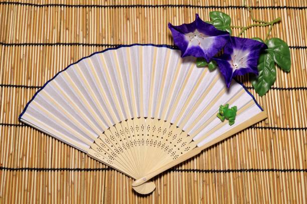 istock Folding fan and Artificial flower morning glory 956866888