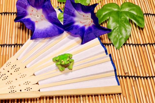 istock Folding fan and Artificial flower morning glory 956870472
