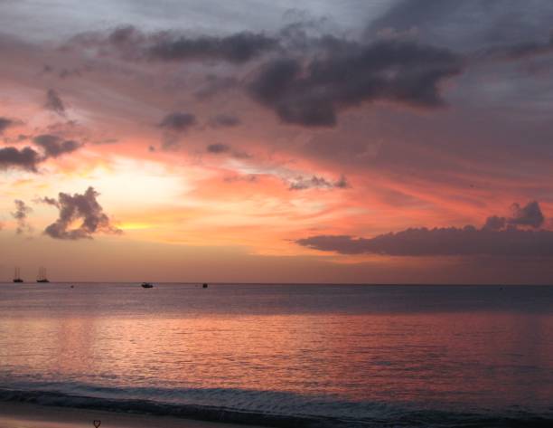 istock Red, Orange and Golden Sky at the beach during Sunset 956873372