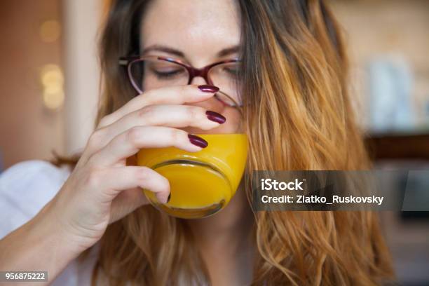 Woman Drinking Juice Stock Photo - Download Image Now - Drinking, Orange Juice, One Woman Only